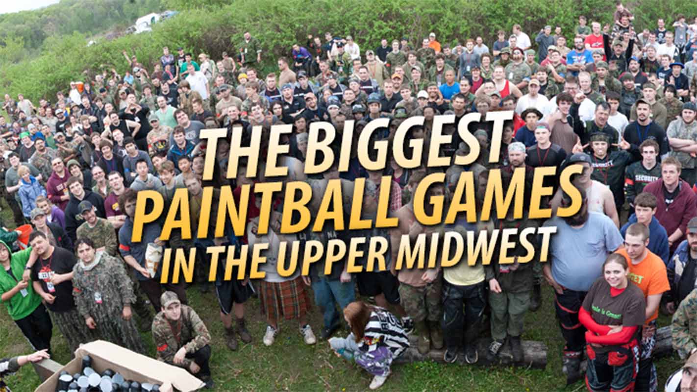 Large group of paintball players gathered for a massive outdoor scenario game